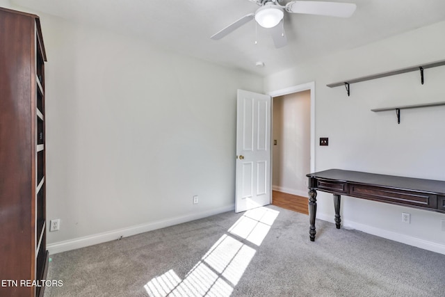 unfurnished office with light colored carpet and ceiling fan