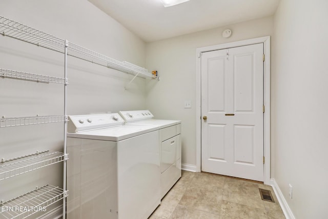 laundry area featuring independent washer and dryer