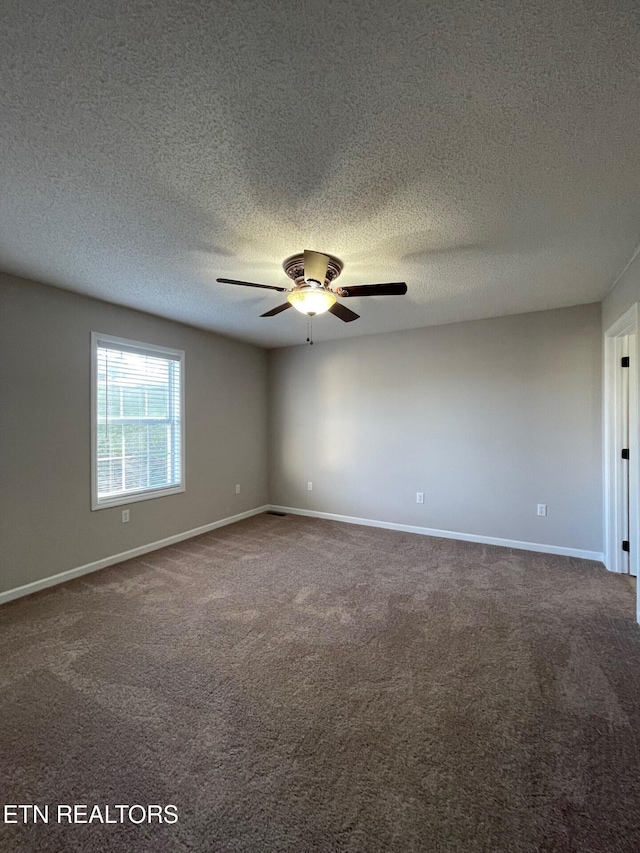 unfurnished room featuring a textured ceiling, carpet floors, and ceiling fan