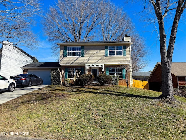 front of property featuring a garage and a front yard