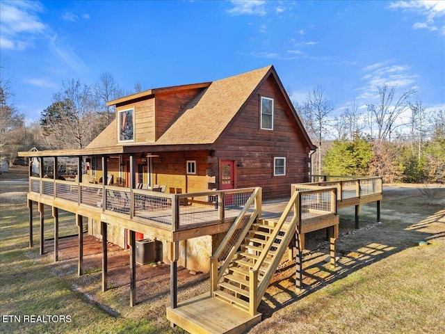 rear view of property featuring a deck and central air condition unit