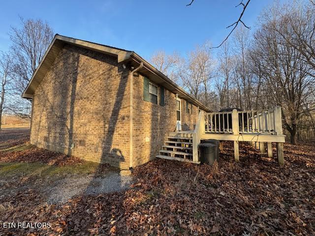 view of home's exterior with a deck