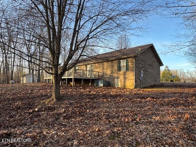 view of side of home featuring a deck