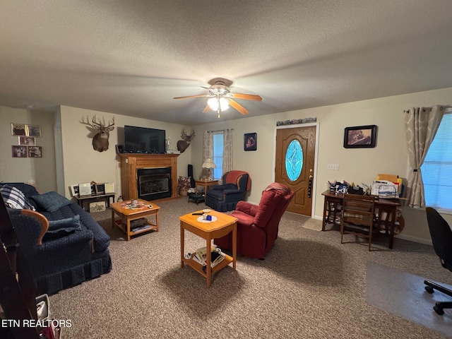 1039 S Ln, Grimsley, TN 38565 - carpeted living room with ceiling fan, a glass covered fireplace, and a textured ceiling