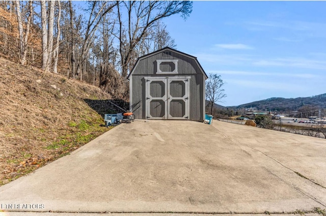 view of outbuilding with a mountain view