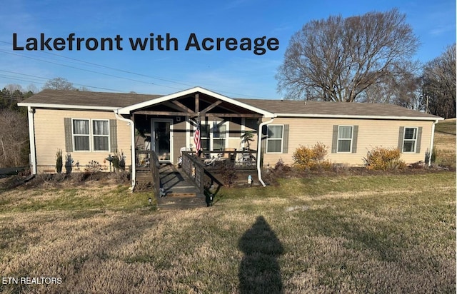 view of front facade with covered porch and a front lawn