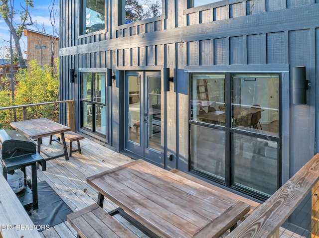 wooden deck featuring french doors