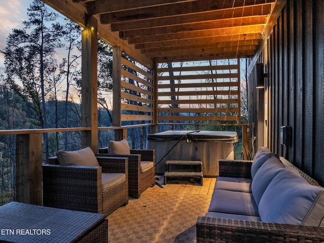 deck at dusk featuring an outdoor living space