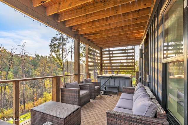 deck featuring a hot tub and outdoor lounge area