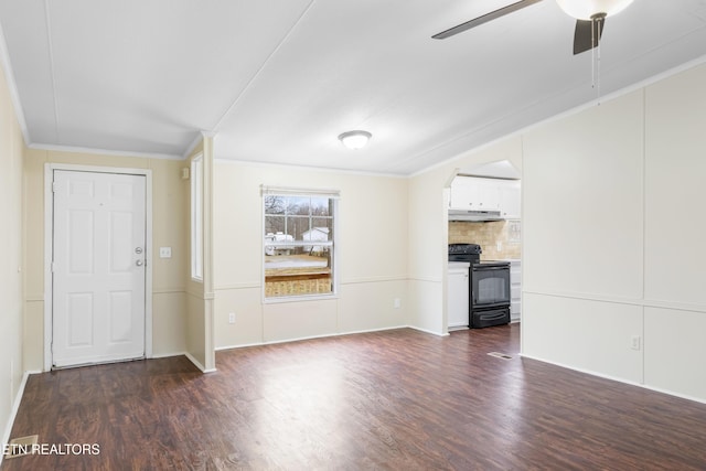 unfurnished living room featuring ornamental molding and dark hardwood / wood-style floors