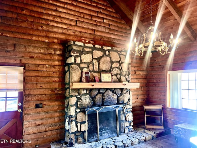 interior details with hardwood / wood-style flooring, a notable chandelier, a fireplace, and log walls