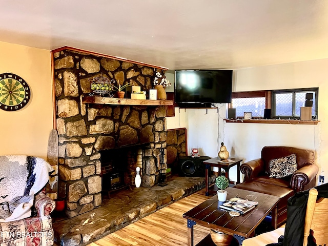 living room featuring hardwood / wood-style flooring and a fireplace