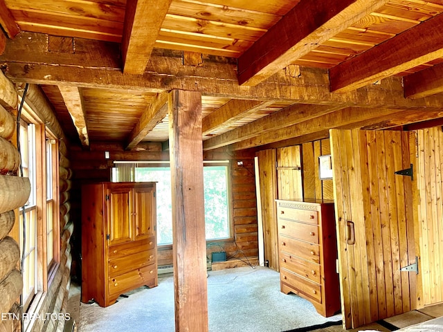 interior space featuring beam ceiling, light colored carpet, log walls, and wood ceiling