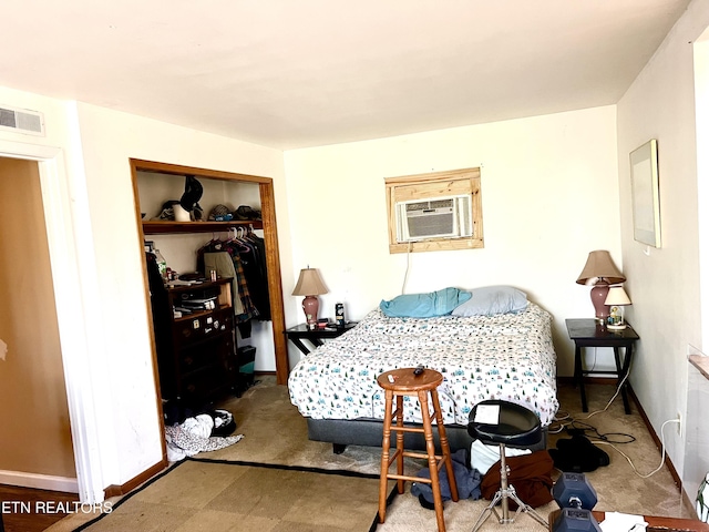 bedroom featuring cooling unit and a closet