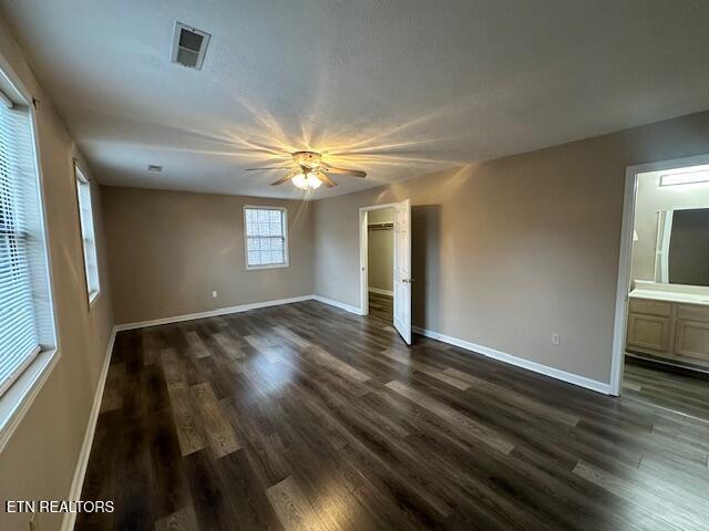 empty room featuring dark hardwood / wood-style flooring