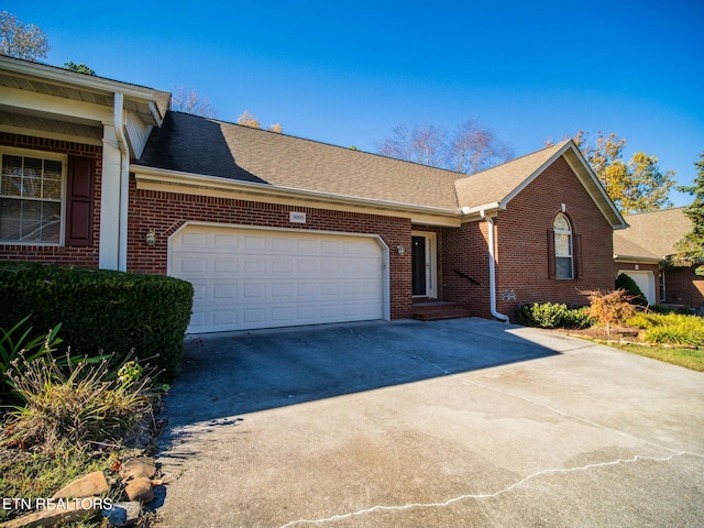 single story home with a garage