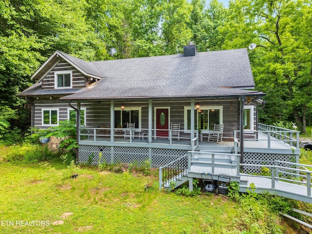 log-style house with a porch