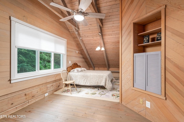 bedroom featuring vaulted ceiling with beams, wood ceiling, wooden walls, and wood-type flooring