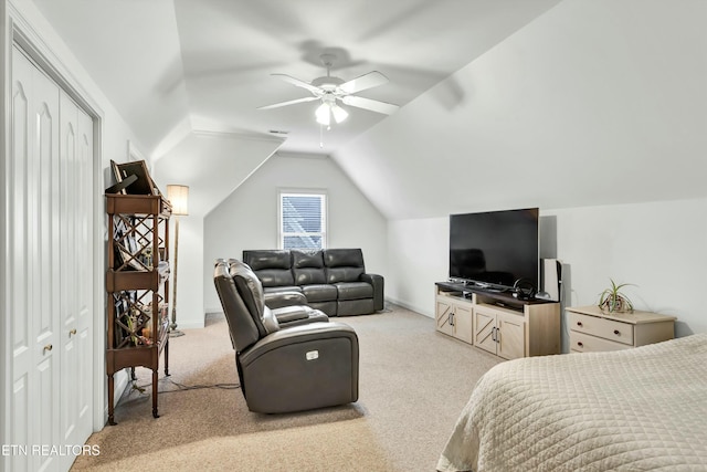 bedroom featuring lofted ceiling, light colored carpet, and ceiling fan