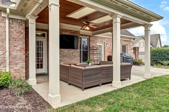 view of patio featuring ceiling fan, grilling area, and outdoor lounge area