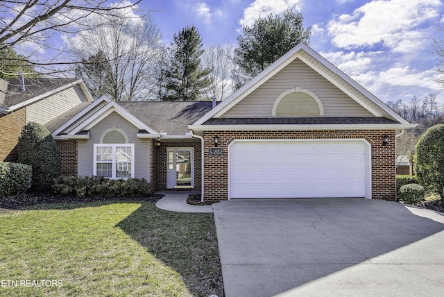 view of front of house featuring a garage and a front yard