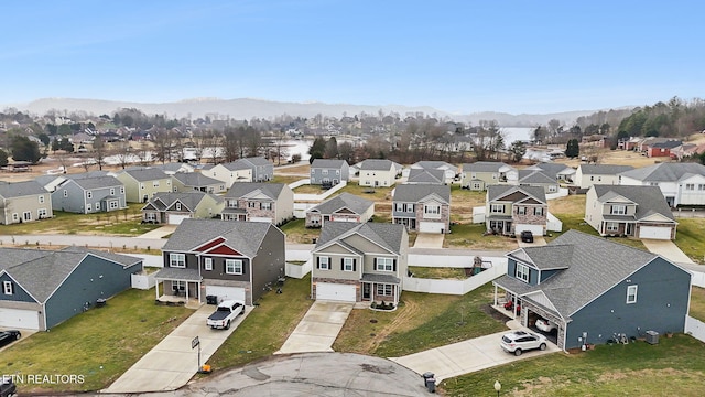 birds eye view of property featuring a mountain view