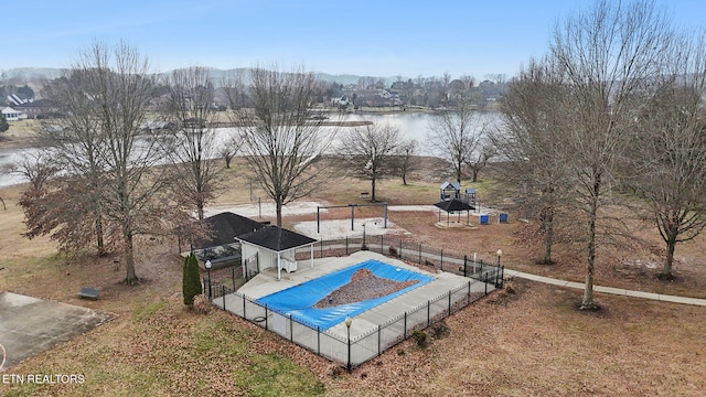 view of pool with a water view