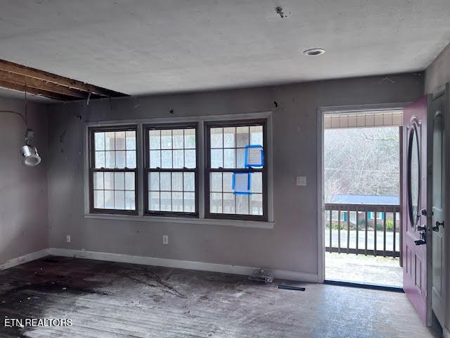 empty room with hardwood / wood-style floors