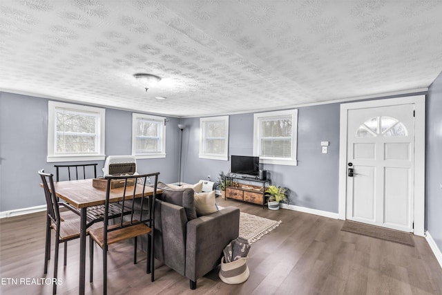 living room with dark wood-type flooring and a textured ceiling