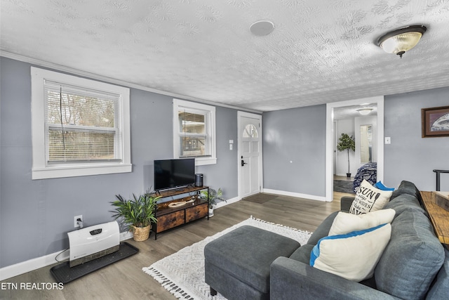 living room featuring dark hardwood / wood-style floors and a textured ceiling