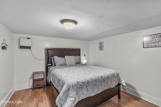 bedroom with wood-type flooring