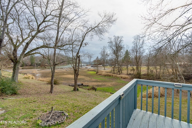 wooden deck with a yard