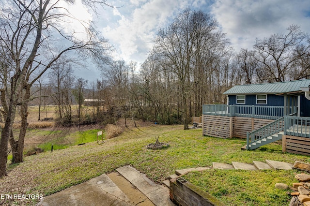 view of yard featuring a wooden deck