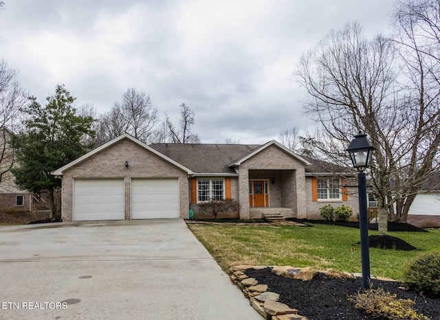 ranch-style home featuring a garage and a front lawn