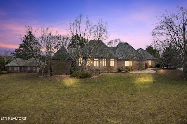 view of front of property with a yard