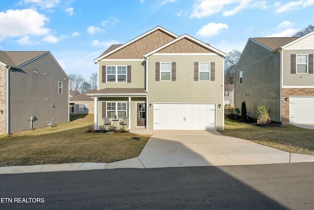 view of front facade with a garage and a front lawn