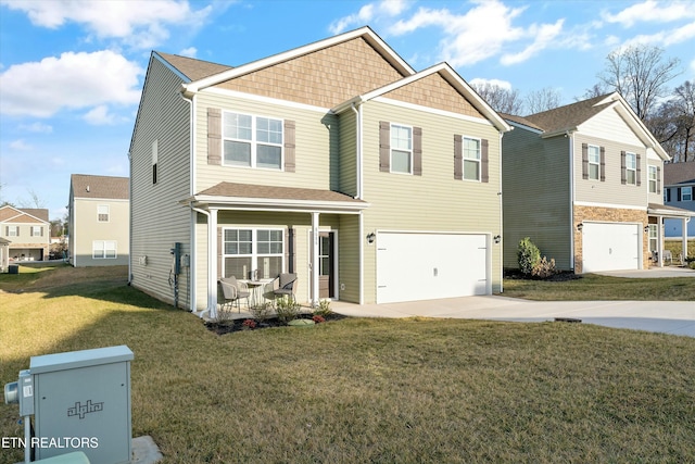 view of front facade with a garage and a front yard