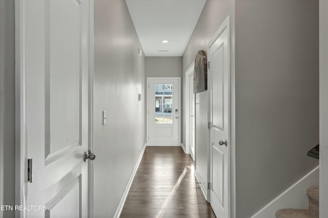 corridor featuring dark hardwood / wood-style floors