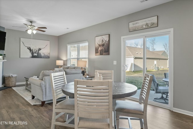 dining room featuring dark wood-type flooring and ceiling fan