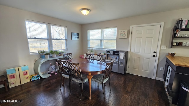 dining space featuring dark wood-type flooring