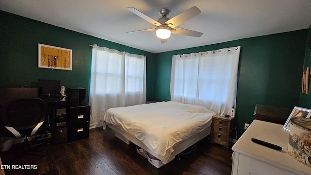 bedroom with dark wood-type flooring and ceiling fan