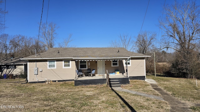 back of house featuring a yard and a patio