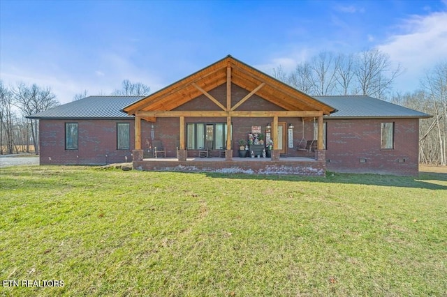 back of house featuring a yard