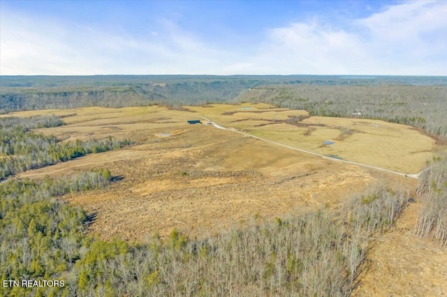 birds eye view of property with a rural view