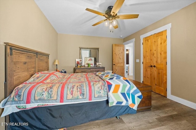 bedroom with hardwood / wood-style flooring and ceiling fan