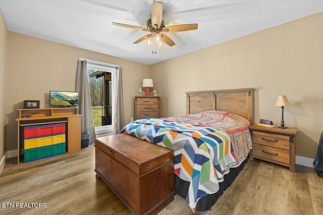 bedroom featuring light hardwood / wood-style floors and ceiling fan