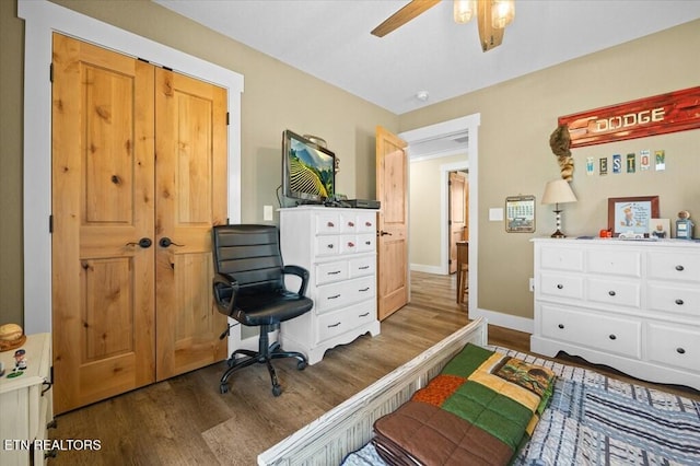 bedroom featuring hardwood / wood-style flooring and ceiling fan