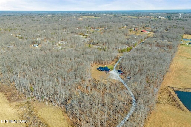 birds eye view of property with a water view and a rural view