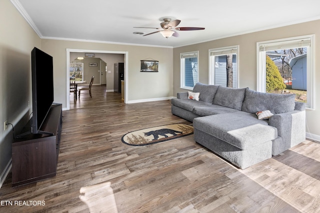 living room with ceiling fan, ornamental molding, and hardwood / wood-style floors