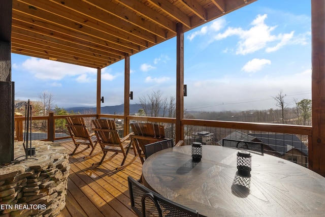 wooden deck featuring outdoor dining space